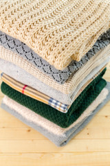 Wall Mural - Stack of white cozy knitted sweaters