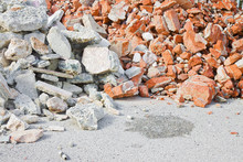 Concrete And Brick Rubble Debris On Construction Site After A Demolition