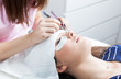 beautician making artificial lashes. eyelash extension procedure 