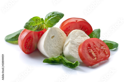 Fotografía mozzarella with tomato and basil isolated on white