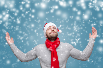 Canvas Print - Handsome man with beard wearing a Christmas hat