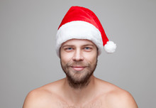 Handsome Man With Beard Wearing A Christmas Hat