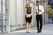 © sata_production - Business colleeagues walking along the office building
