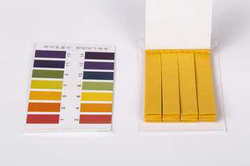 Litmus ph test paper on white.