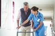 © WavebreakmediaMicro - Nurse helping senior man with walking aid
