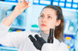 © luchschenF - Young woman in biological laboratory. Attractive young female scientis. Girl with a slide for the microscope University Hospital