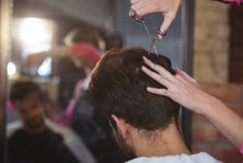 Man Getting His Hair Trimmed