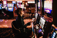 Woman Playing Slot Machine