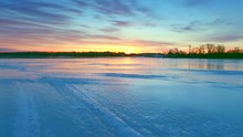 Flying Low Over Scenic Frozen River At Sunrise, The Beauty Gets Even More Amazing When The Ice Gives Way To Open Water.