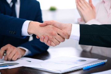 Business people shaking hands finishing up a meeting