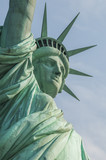 Fototapeta Nowy Jork - Majestic iconic lady liberty statue of liberty in New York harbor welcoming new arrivals