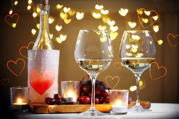 Poster - Glasses and bottle of wine on table. Valentine's day celebration concept.