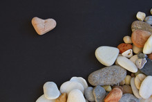 Pink Stone Like Heart Shape And A Lotof Different Pebble On The