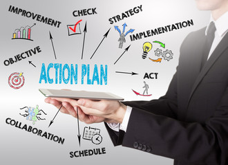 Wall Mural - Action Plan concept, young man holding a tablet computer