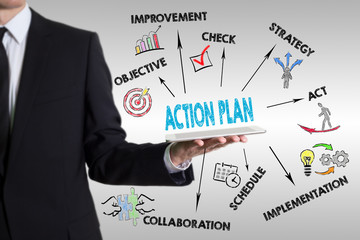 Wall Mural - Action Plan concept. Young man holding a tablet computer