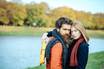 Wall Mural - Young couple in autumn park