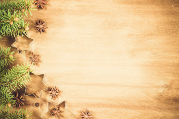 Wall Mural - Culinary background. Cutters for cookie, anise and branch of Christmas tree.