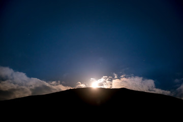 Wall Mural - raising of full moon above mountain