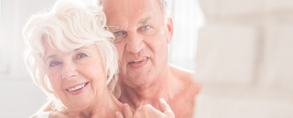 Wall Mural - Older man ebfracing his wife