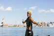 © Westend61 - USA, New York City, Brooklyn, smiling young woman at East River