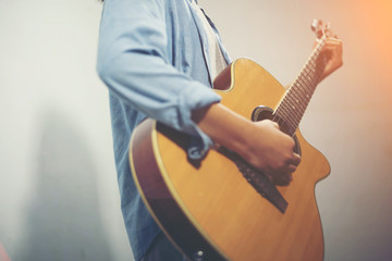 Young woman playing a guitar