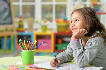 Wall Mural - Little girl drawing 