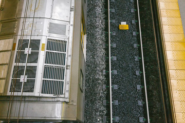 Metro viewed from above stopped at a station in Argentina