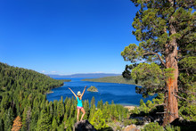 Young Woman Enjoying The View Of Emerald Bay At Lake Tahoe, Cali