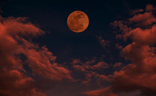 Red Full Moon With Red Cloud And Dark Sky.