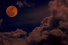 Red Full Moon With Red Cloud And Dark Sky.