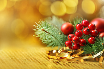 Wall Mural - Composition of mistletoe, ribbon and coniferous branch on blurred background, close up