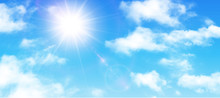 Sunny Background, Blue Sky With White Clouds And Sun
