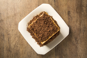 Wall Mural - close up of a chocolate cream cake on white plate