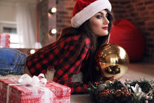 Charming Woman With Dark Hair Posing Near Christmas Tree