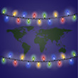 Сhristmas lights and world map. New year.