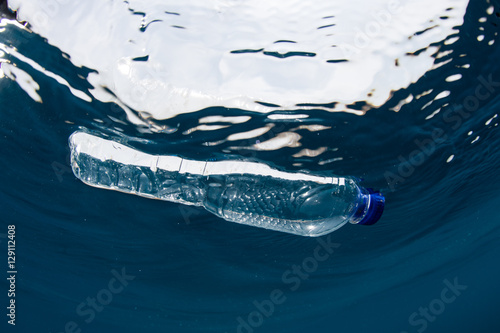 Photo Plastic Bottle Floating in Ocean