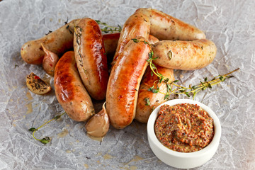 Wall Mural - Home-made Pork Sausages on crumpled paper with thyme