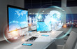 © sdecoret - Workplace with modern devices and hologram screens 3D rendering