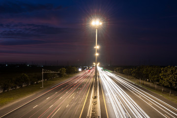 Speed Traffic at light trails on motorway highway at night,backg