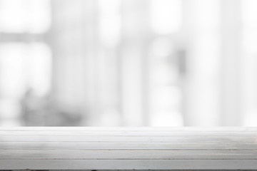 Wood table top and blurred abstract background from interior building - can used for display or montage your products.