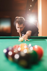 Wall Mural - Player breaks a pyramid in billiards.