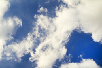 white fluffy clouds in blue sky