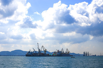 Cargo ship sailing in still water