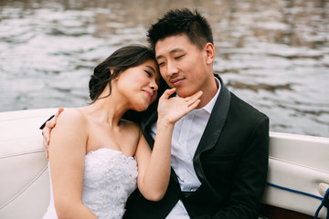 Wall Mural - Bride and groom are floating on a boat on the city's rivers and canals