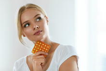 Beautiful Woman Holding Birth Control Pills, Oral Contraceptive