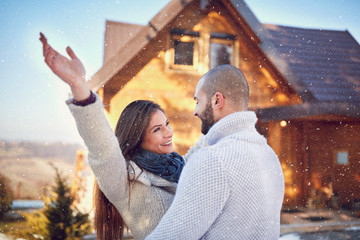 Wall Mural - Cheerful girl with guy on mountain