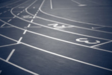 Black And White, Blurred Image Of Running Track With Numbers From 1 To 3. Curves Of A Running Track. 