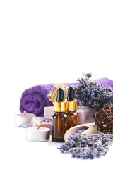 Wall Mural - Lavender oil with soap and flowers isolated on a white