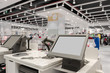 © focusandblur - Registers and monitors in a large clothing store. Background sto