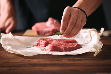 Poster - Butcher cooking pork meat on kitchen